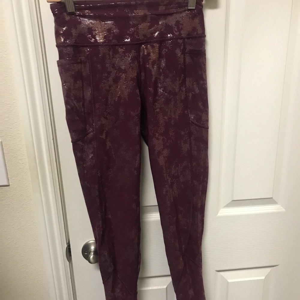 Victoria Secret Burgundy with silver and gold leggings.